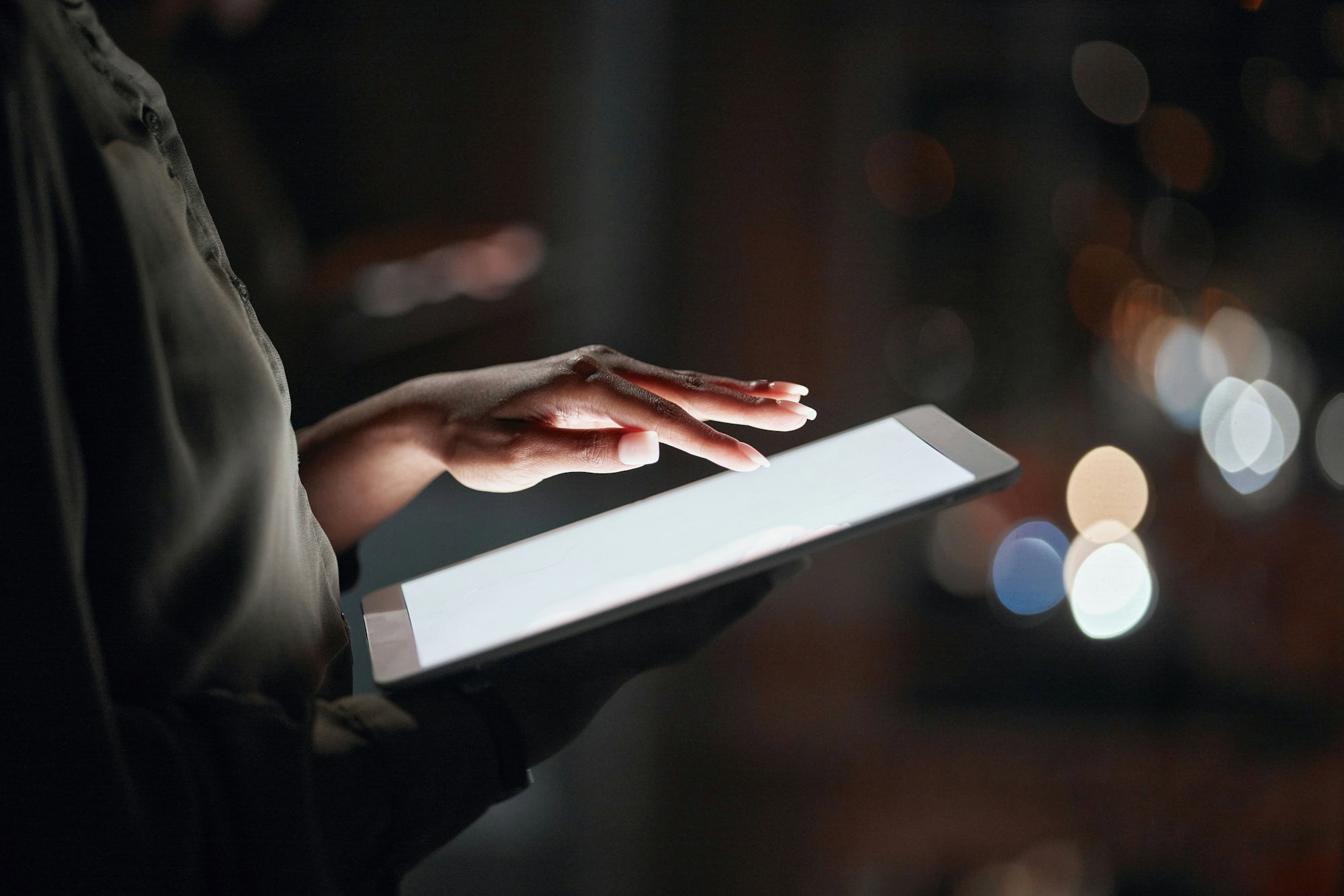 Woman, hands and tablet mockup at night for networking, social media or advertising at the office.